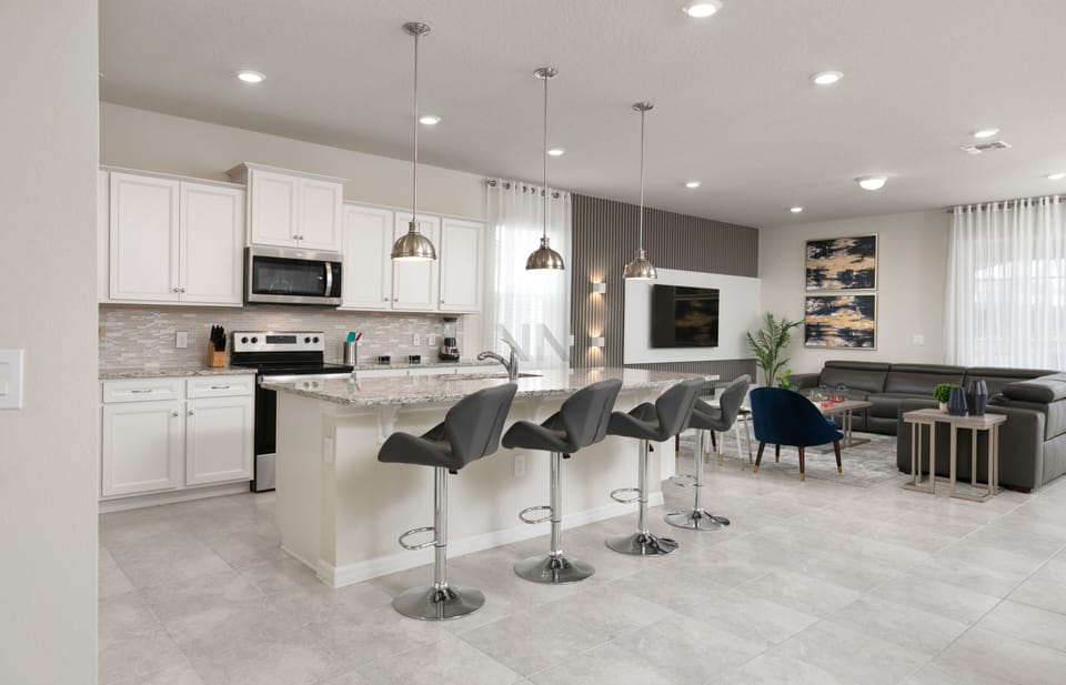 The open kitchen, connected to the living room, keeps everyone together.