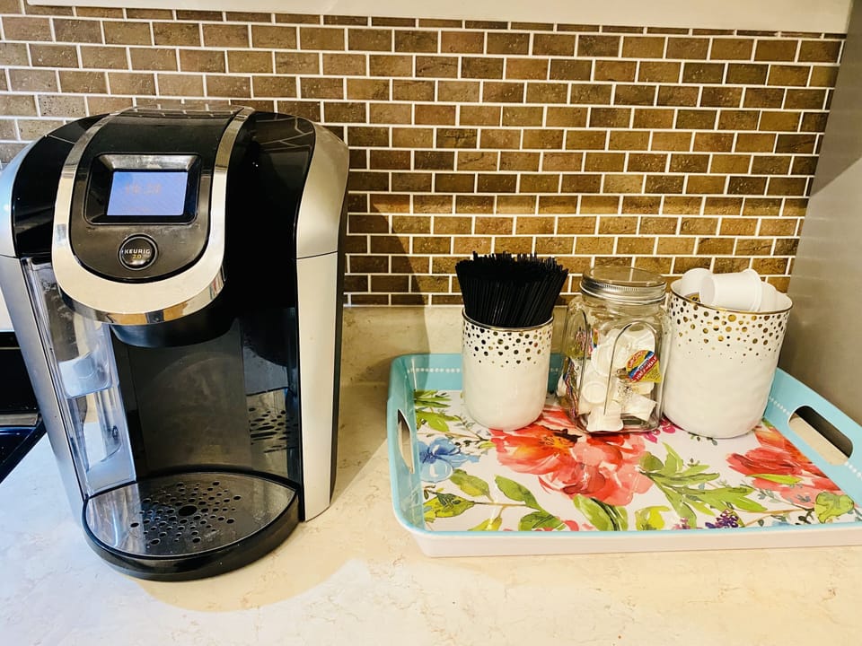 Keurig with K-cups and creamer provided