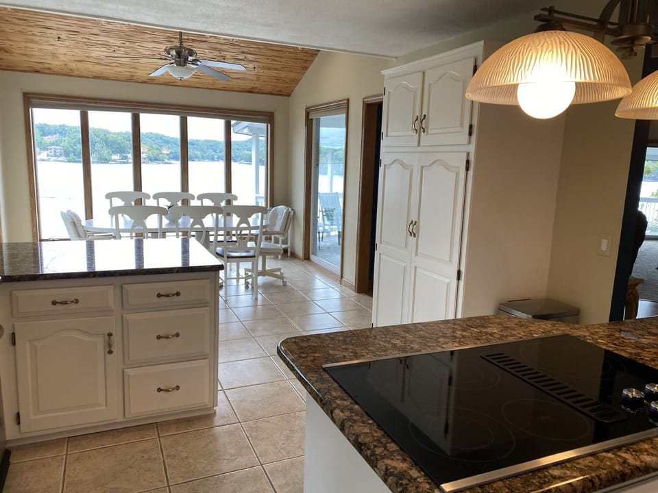Kitchen w/cooktop island. Replaced table and chairs. Will update pictures soon.
