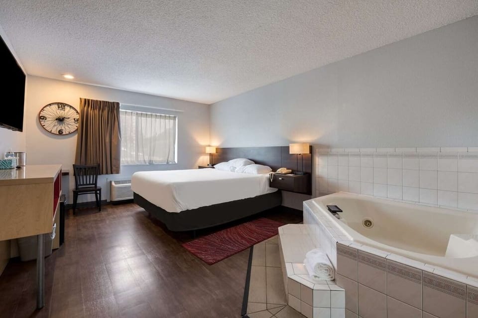 Indulge in a soothing soak steps from your plush bed.