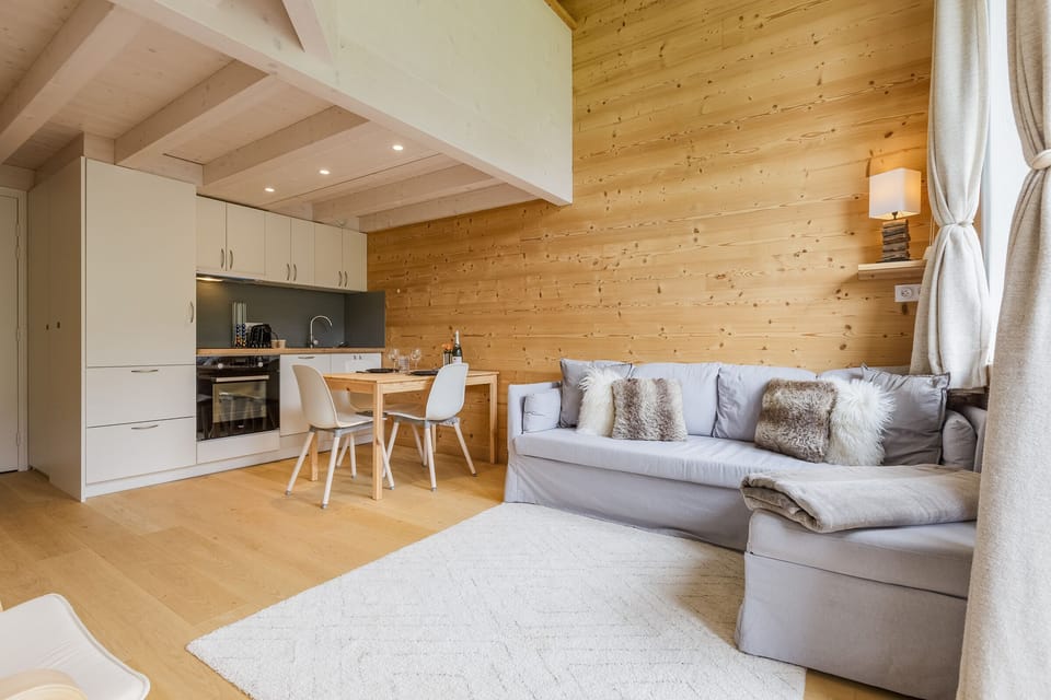 Open plan living room with a well equipped kitchen