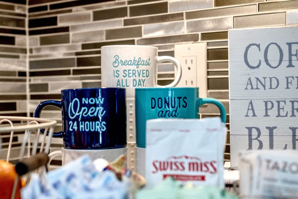 Coffee bar with Keurig and a drip coffee maker.