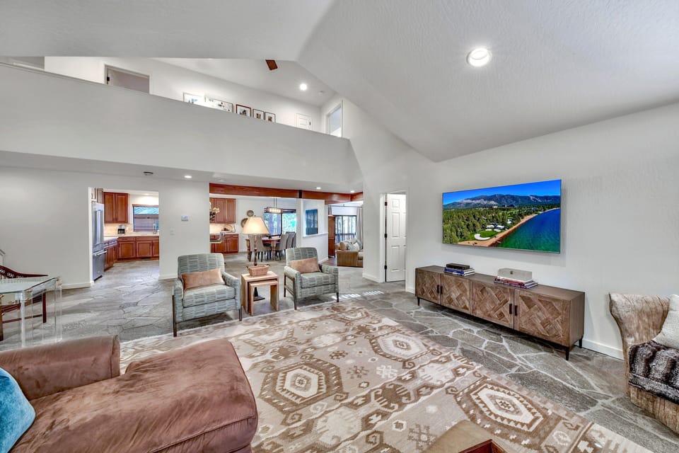 Living room with views of the kitchen and dining room
