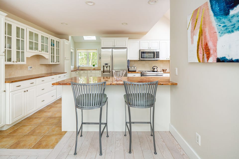 Kitchen - granite counter; 2 sinks; new Jenn-air range; electric stove top.