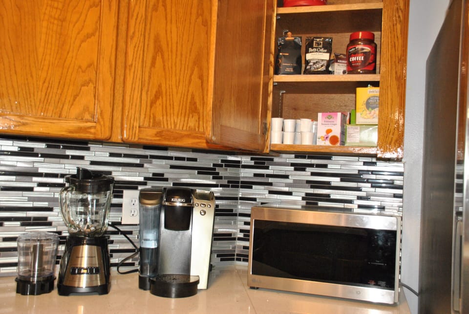 Plenty of coffees and teas in the cabinet.