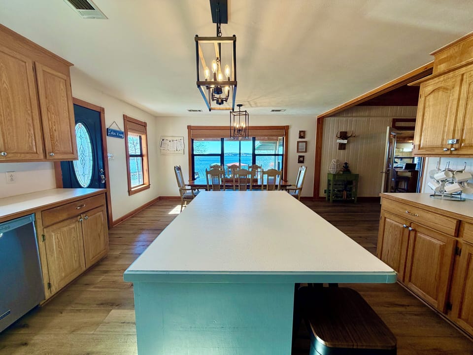 island in kitchen with four barstools