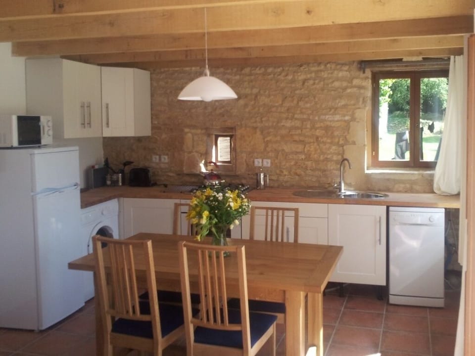 Open plan kitchen and dining area, with lovely French oak table