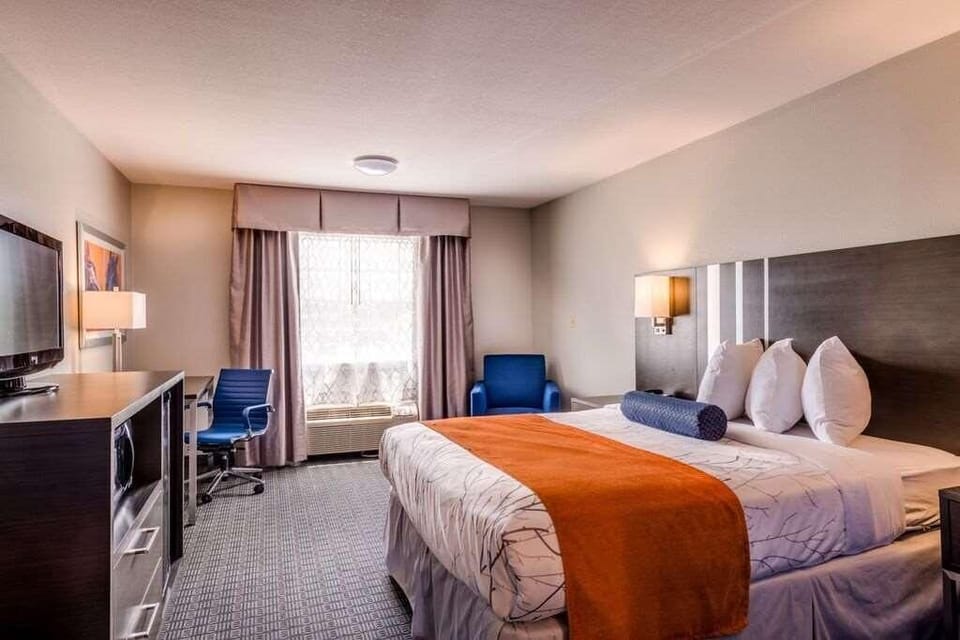 Settle in with a dedicated desk, TV, and cozy seating.