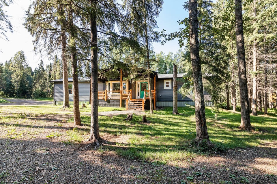 Nestled into a forested yard. 