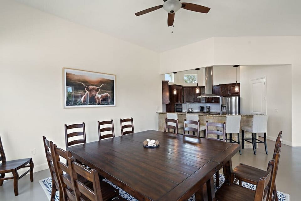 [Dining Room] Formal dinner space with seating for 18 and counter stools