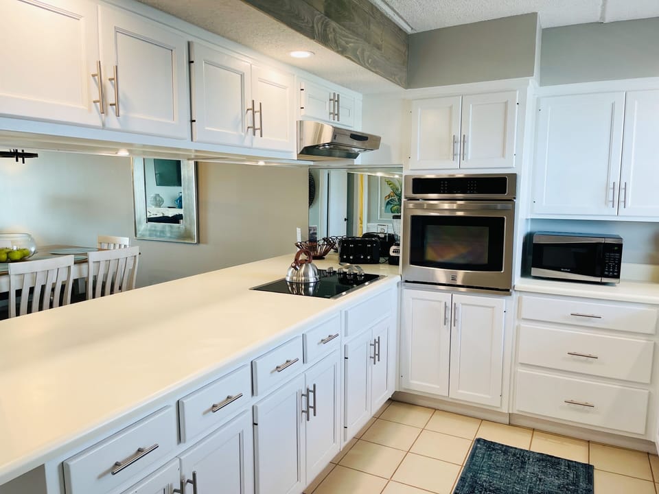 Fully stocked kitchen with stainless steel appliances