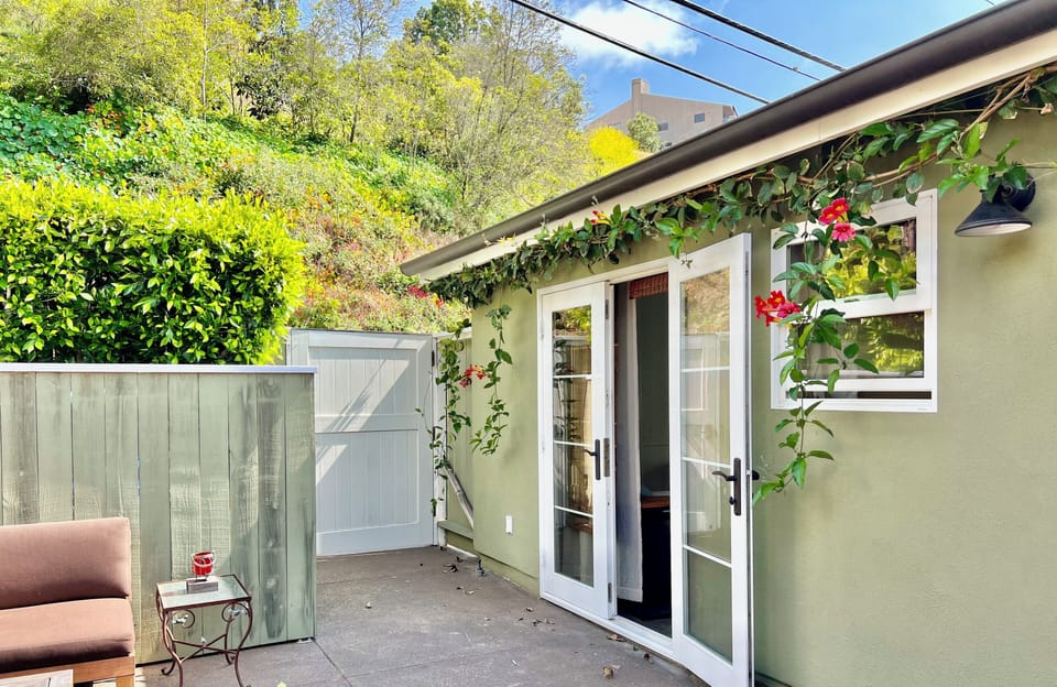 French doors inviting the ocean breeze and sounds of soothing fountain. 