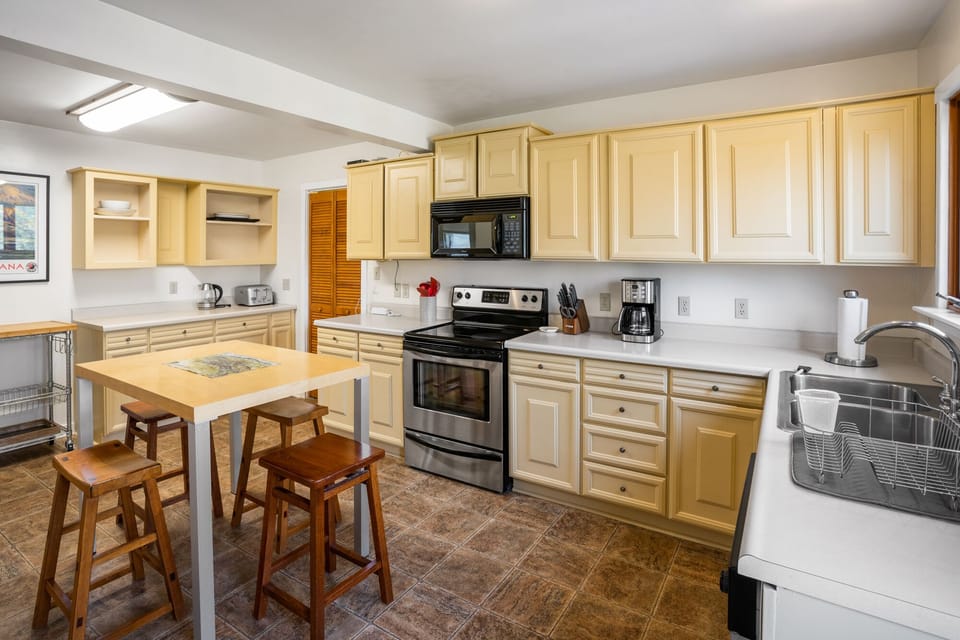 Seat four guests at the kitchen island for breakfast or coffee.