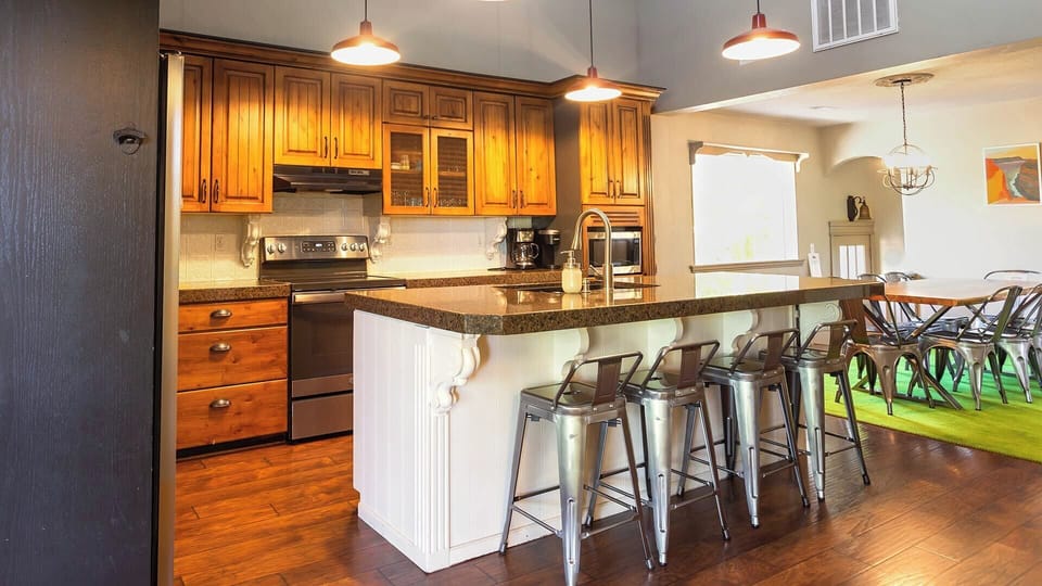 Make yourself comfortable at the kitchen island and savor the anticipation of dinner.