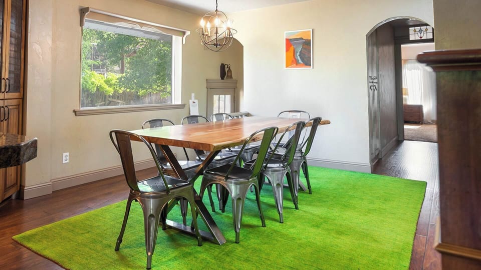 The kitchen island isn’t the only place to gather. The dining table offers seating for eight.