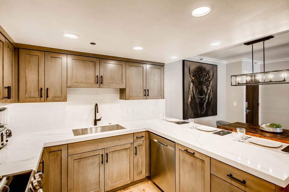 Solid wood cabinets and marbled granite countertops in the kitchen