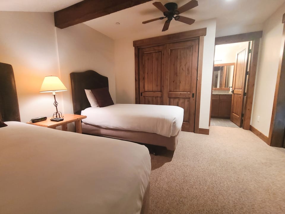 Fifth bedroom includes two twin beds with comfortable white linen