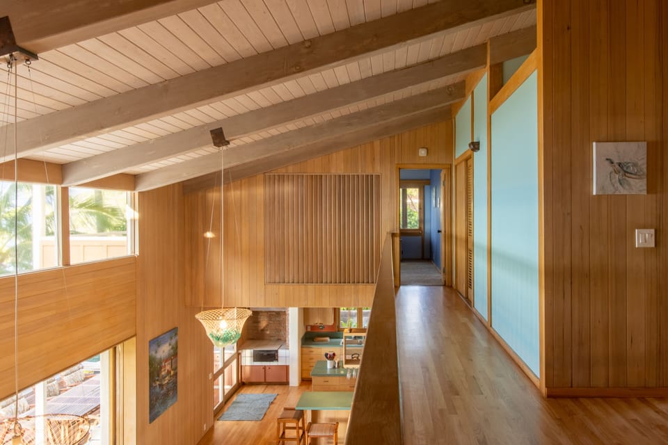Hallway overlooking living room. Ocean views. Facing master. 

