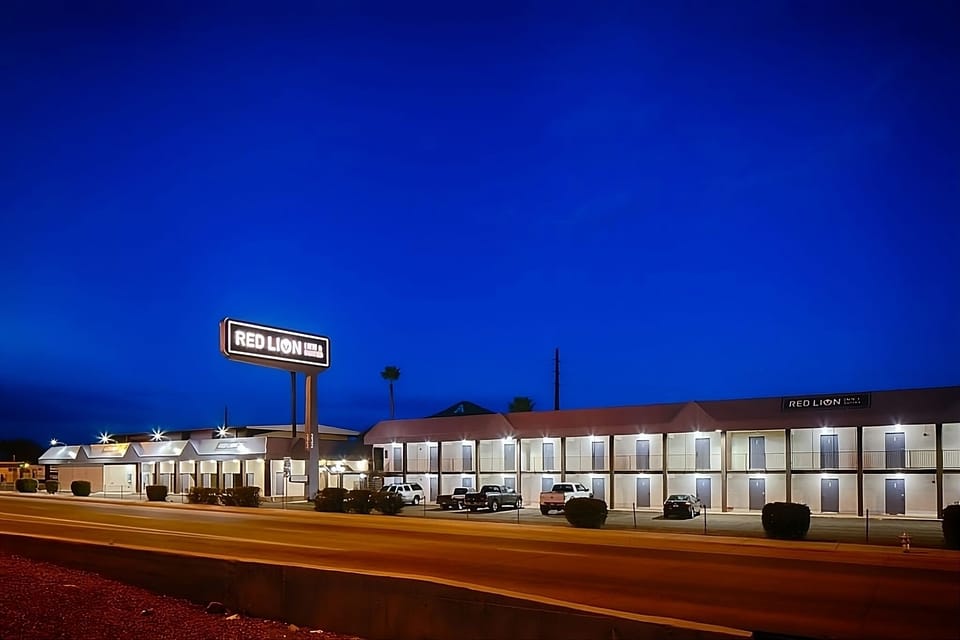 Arrive effortlessly to a well-lit, welcoming hotel frontage.