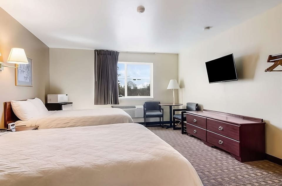 Recharge with in-room microwave, mini fridge, and cozy chairs.
