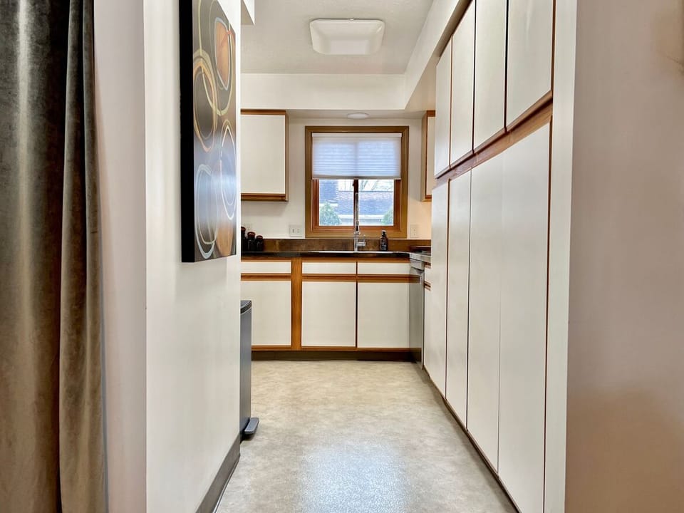Entry to kitchen with large pantry’s on the right.