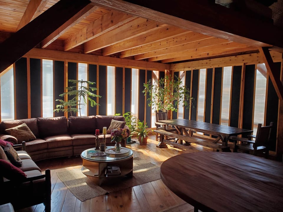 Family room, dining table with seating for 10, plus four bar stools at counter.