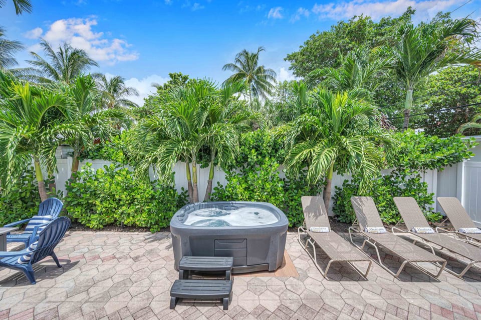 Surf Key - the hot tub, loungers and a fire pit are discreetly located in the back yard.