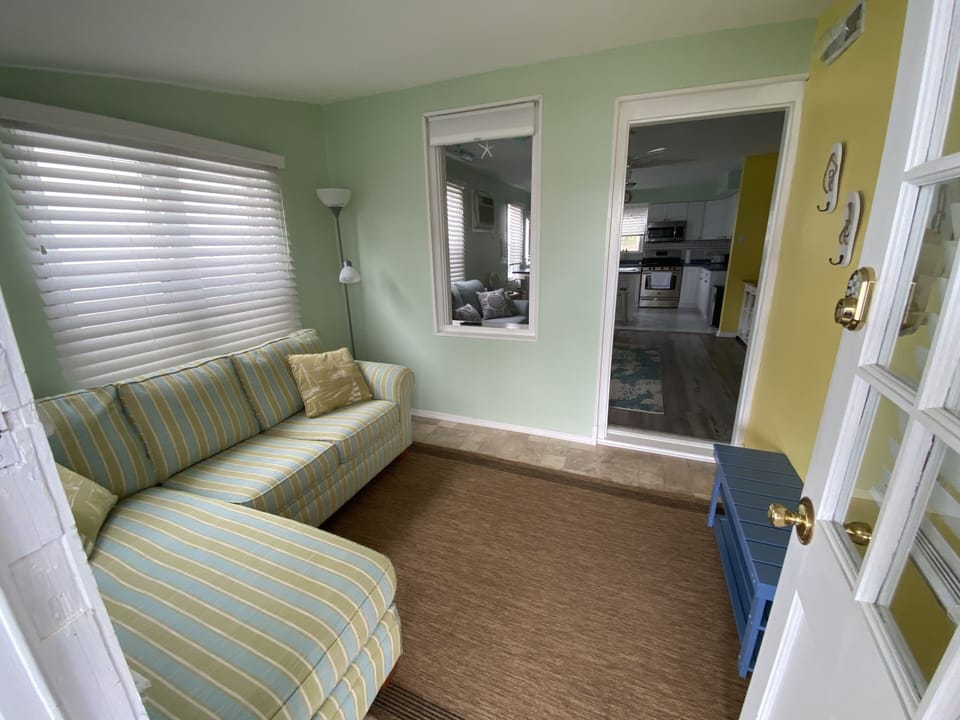 Sleeping porch, with TV, sofa is pull out queen bed with new mattress 