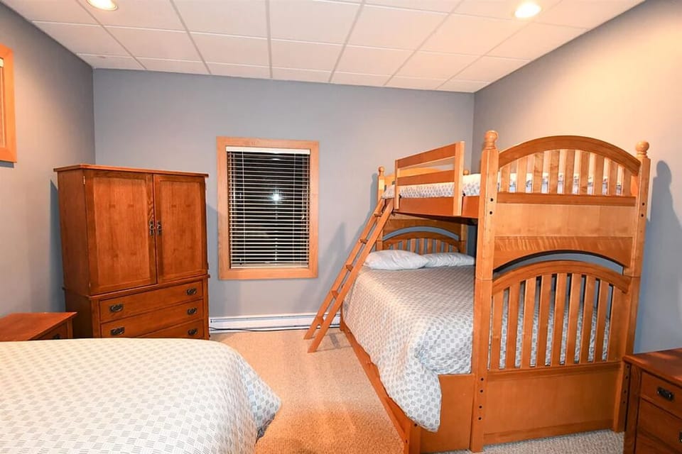 Lower Bedroom #1 - Queen Bed & Single over Double bunk bed