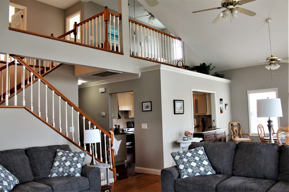 Living room to kitchen and loft