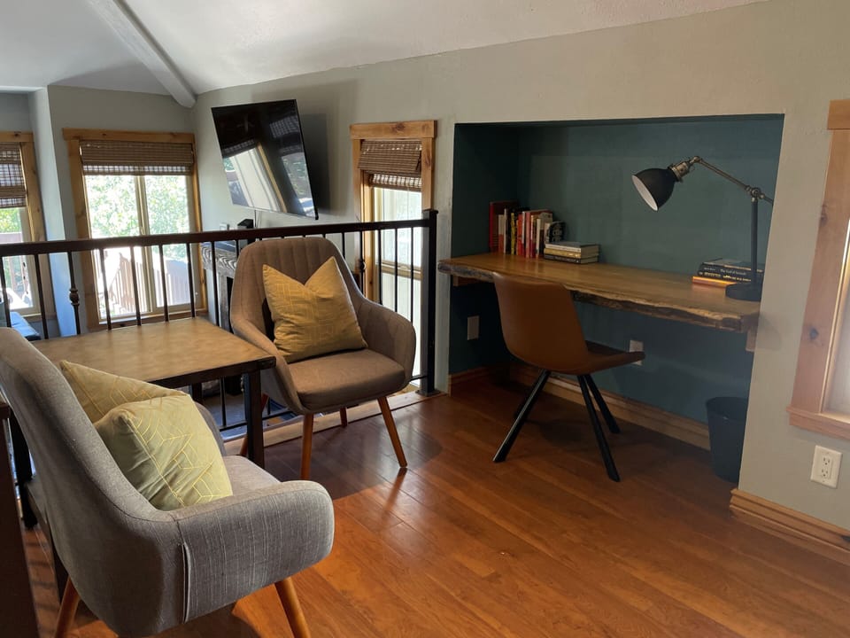 Loft area adjacent to living room for extra room to stretch out
