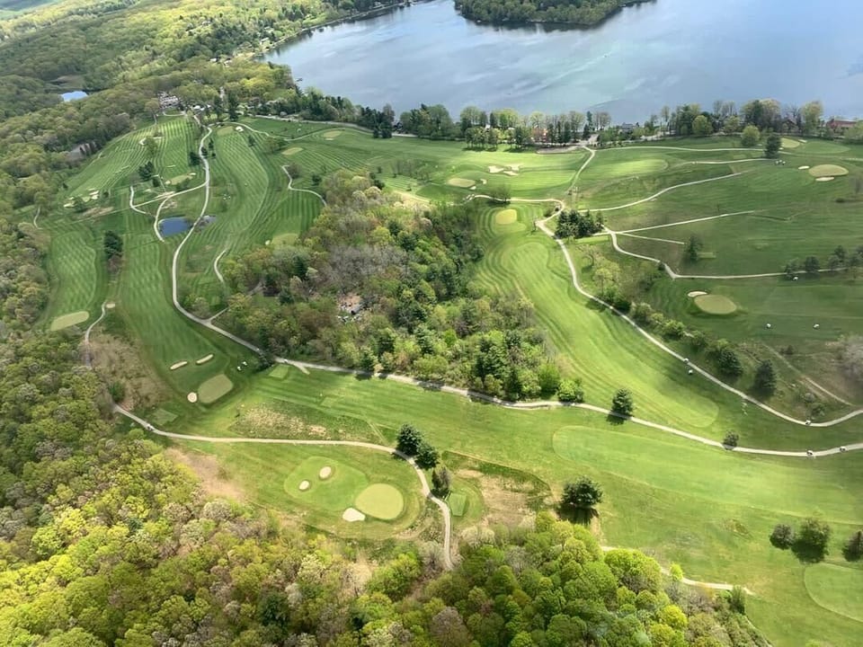 The Copake Country Club golf course, outdoor leisure space, and restaurant