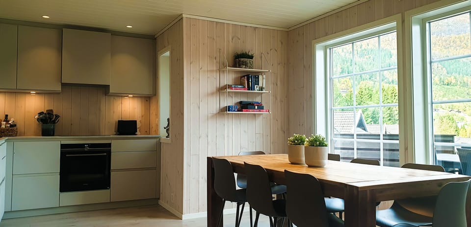 Dining table with a view and open solution to the kitchen