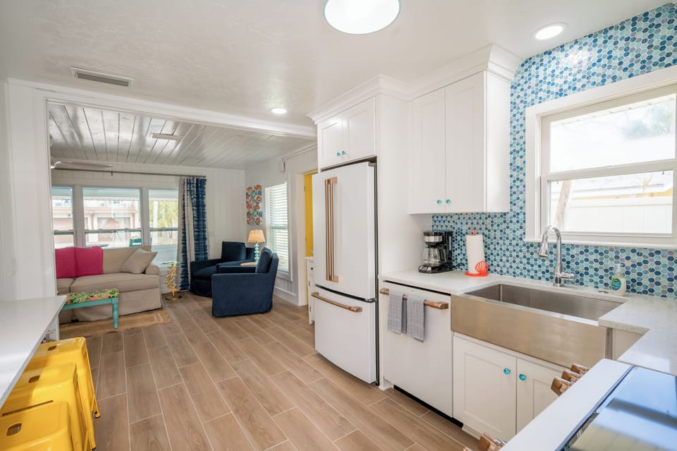 Beautiful new kitchen with glass tile backsplash
