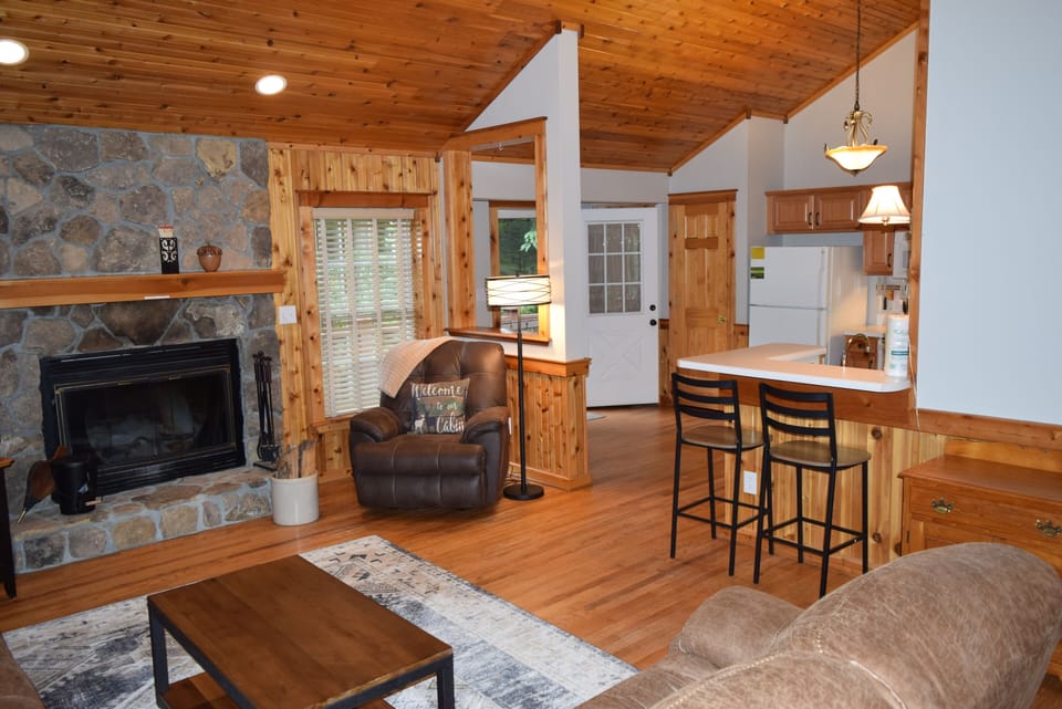 Open living/kitchen keeps everyone connected. Vaulted ceilings feel spacious.