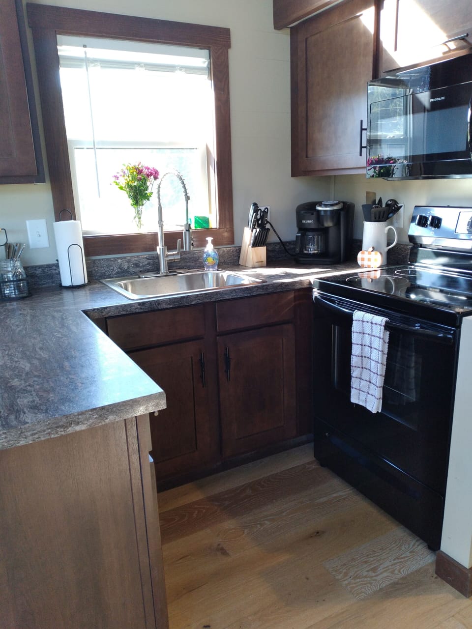 Kitchen with dishwasher, stove/oven, microwave, and Keurig K-Duo