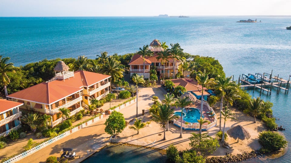 Surrounded by water, protected by mangroves; steps to the pool, palapa, docks.