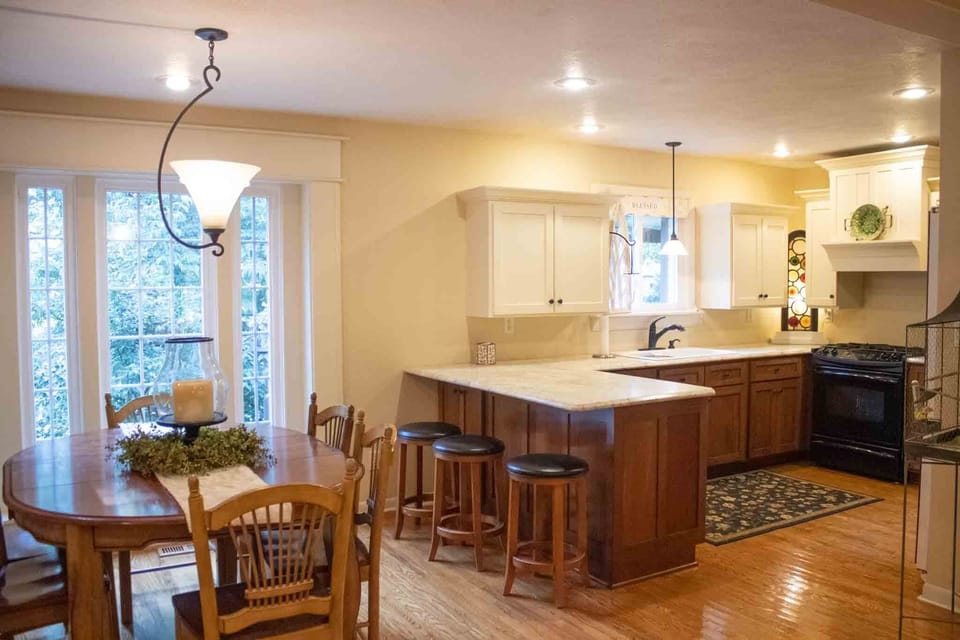 Open kitchen with island seating and dining table to seat 6 