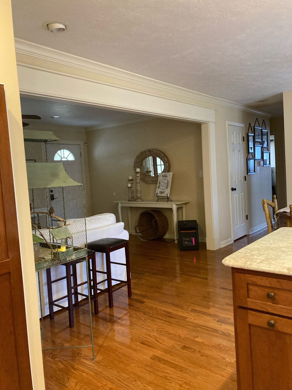 Looking down the hall and into the front room from the kitchen 