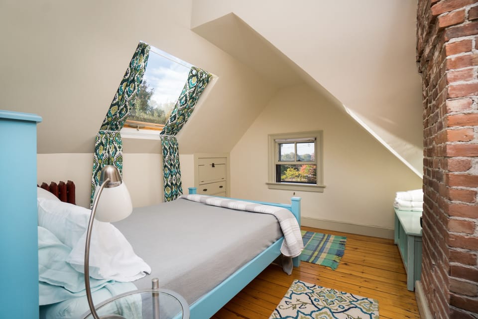 Private Bedroom w/ Queen bed, skylight, A/C mini-split and Smart TV (not shown)