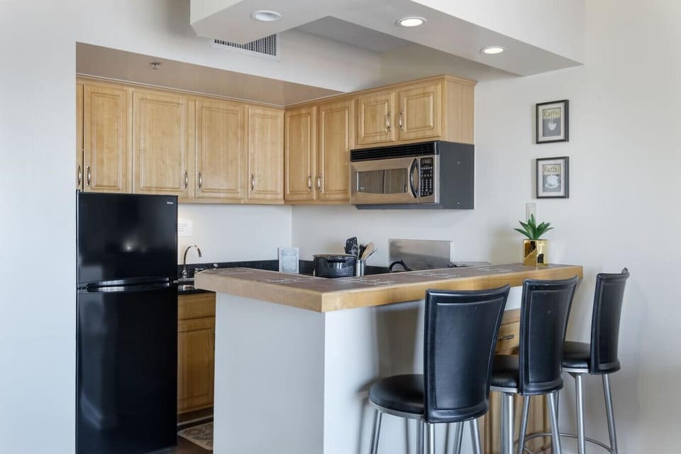Sip some coffee at the kitchen bar, outfitted with seating.