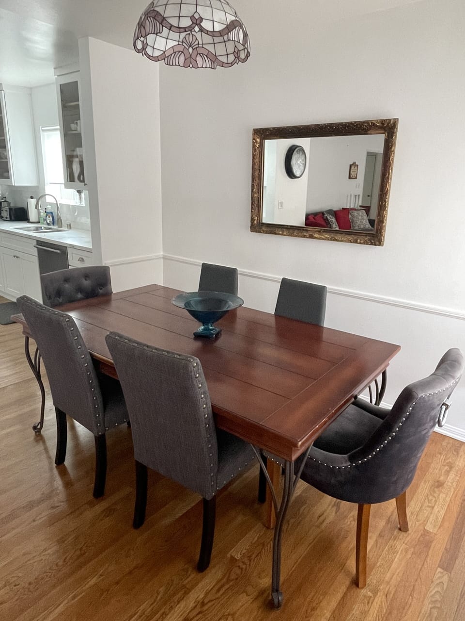 Wood dining room table with comfortable dining chairs.
