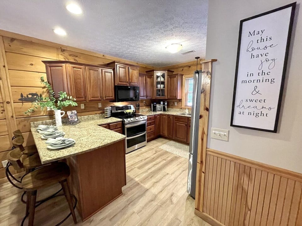 Kitchen area is fully stocked with quality cookware and utensils
