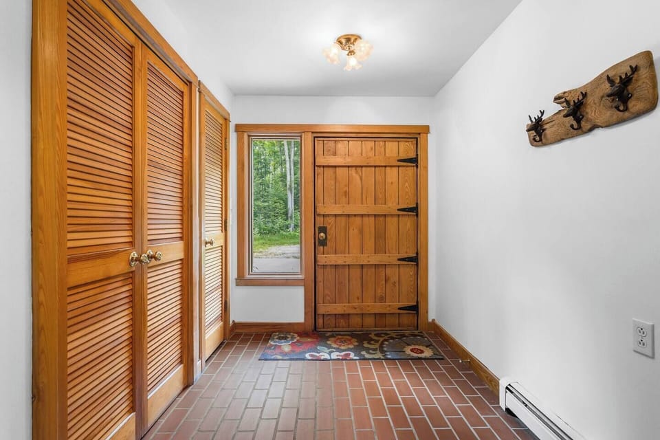 Lower level entryway provides lots of space for bringing in luggage, coats, and storing shoes during your stay. 