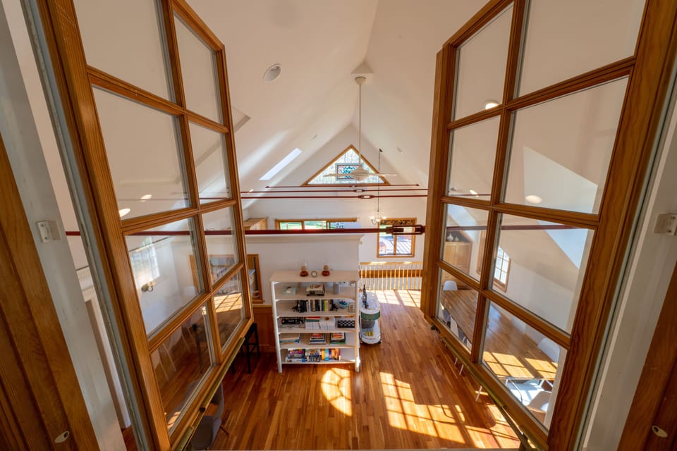 View of Living Room + Dining area from interior playspace.