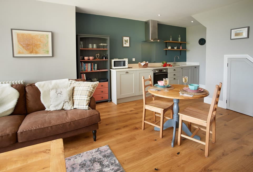 Ground floor:  Spacious and light open-plan sitting, dining and kitchen area