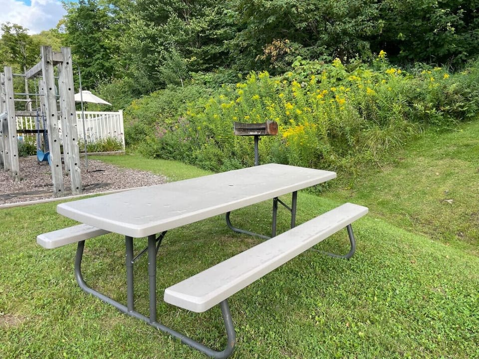 Family-friendly outdoor space with seating and a play area.