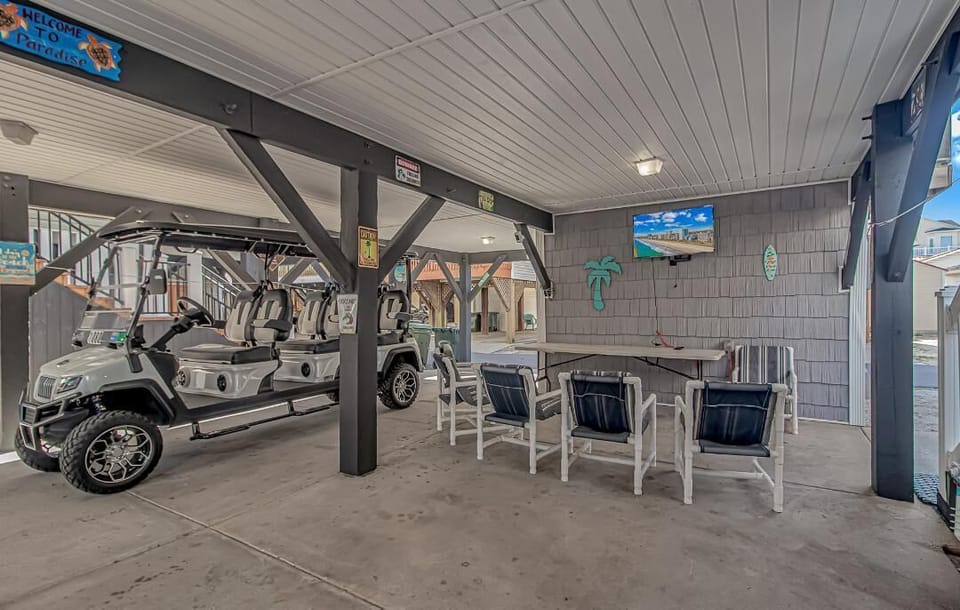 Under house with TV and brand new 6 person golf cart.  Golf cart is additional.