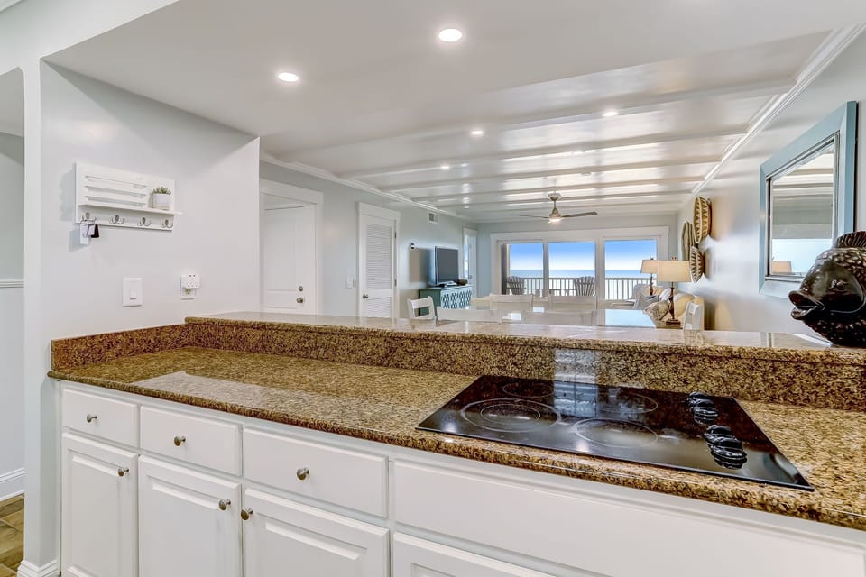 Fully Equipped Kitchen with Granite Countertops, Stainless Steel Appliances, and Gorgeous Ocean Front Views