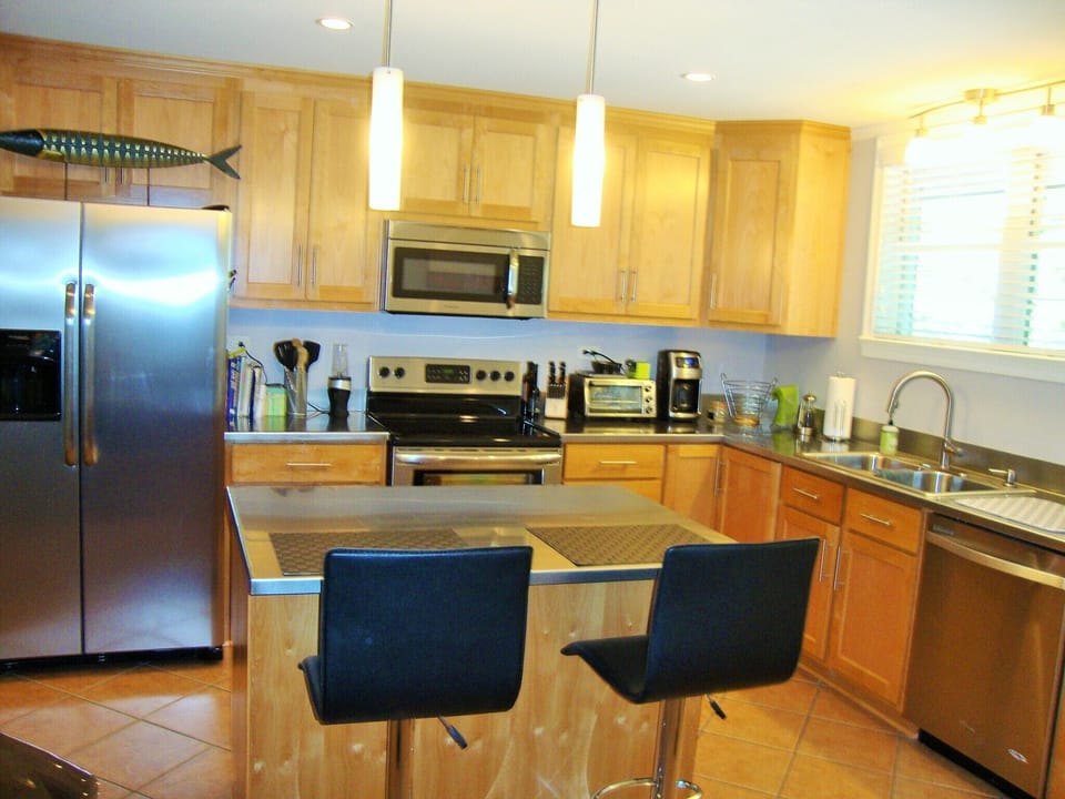 Spacious kitchen with stainless steel counters and lots of room to move